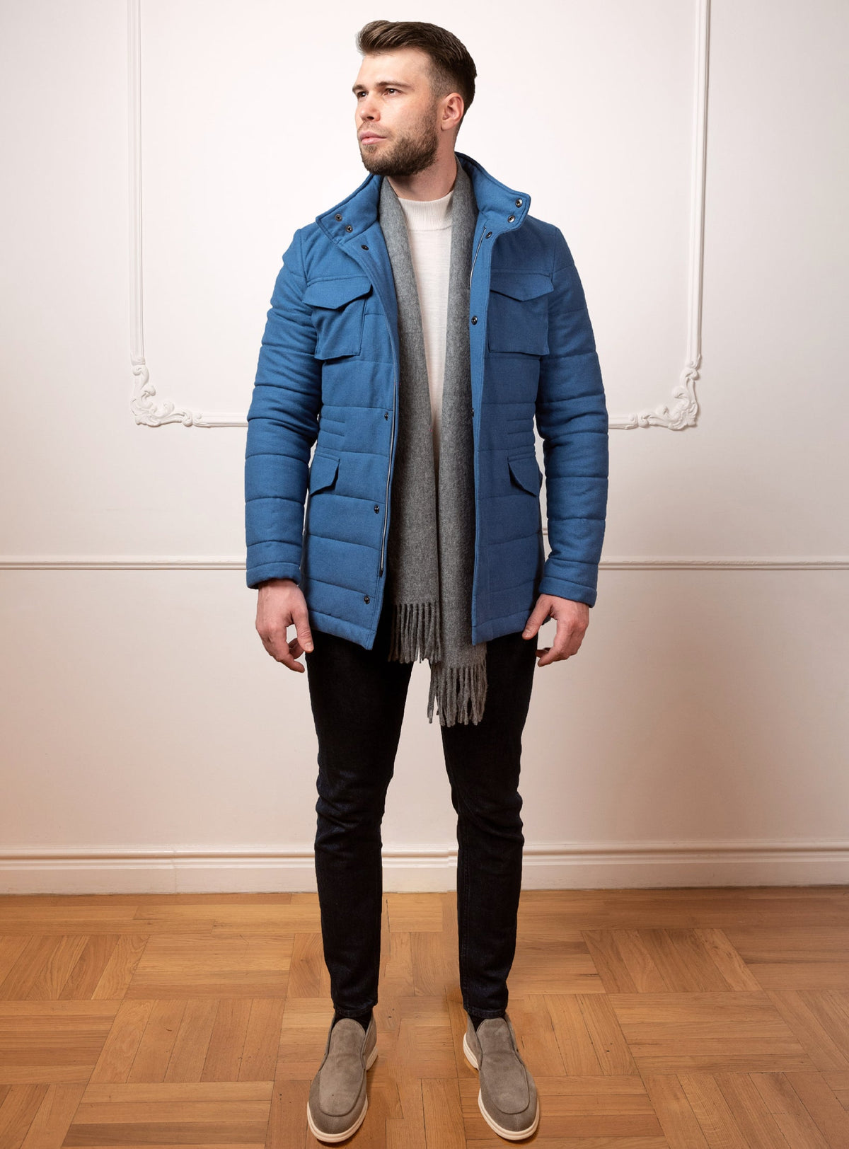 Consiglieri Meribel: blue quilted jacket with patch pockets and a grey scarf