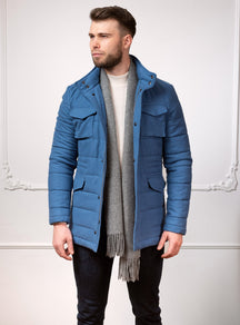 Consiglieri Meribel: blue quilted jacket with patch pockets and a grey scarf