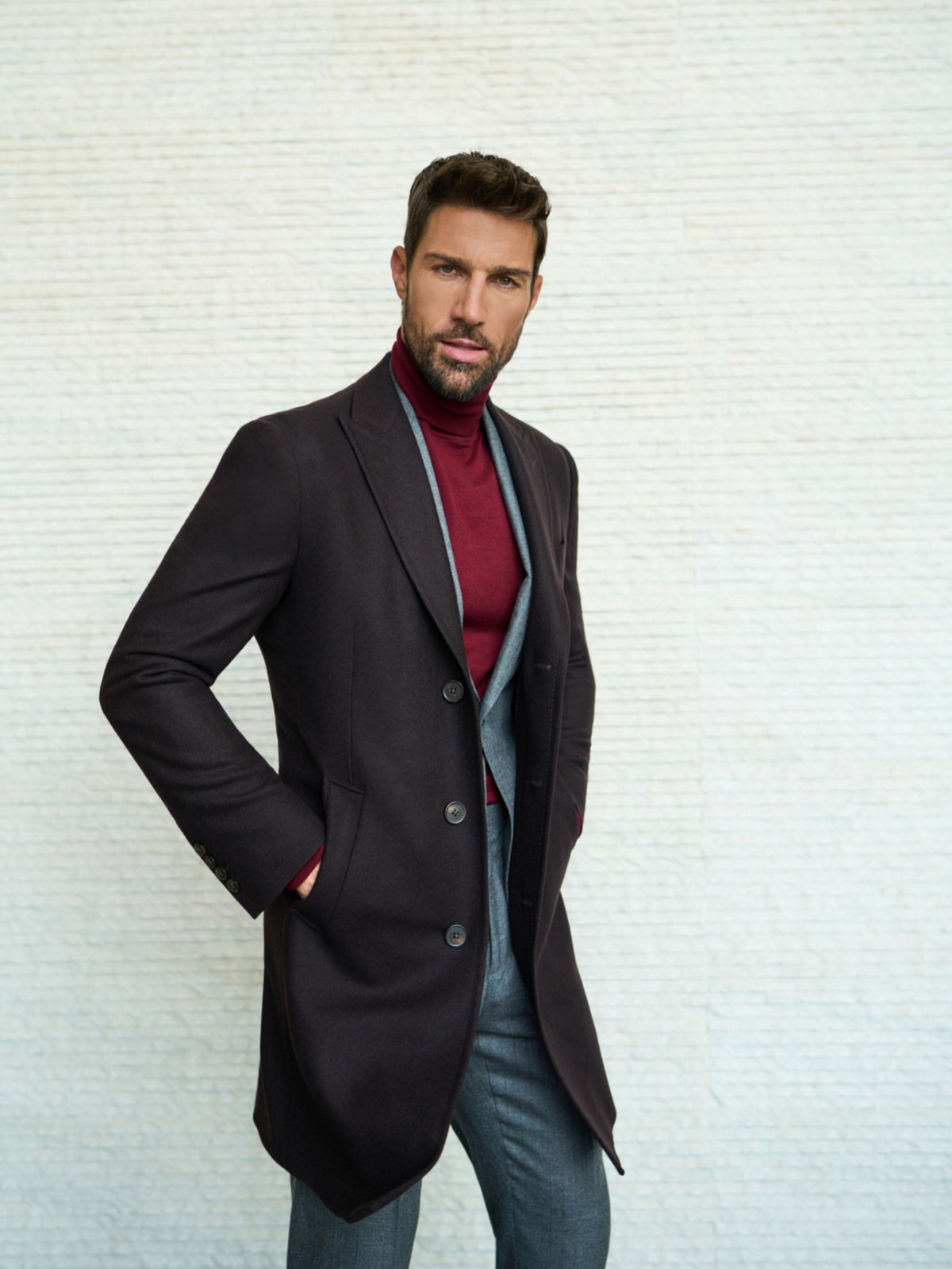 Consiglieri Meribel: dark overcoat with a burgundy roll-neck and grey suit