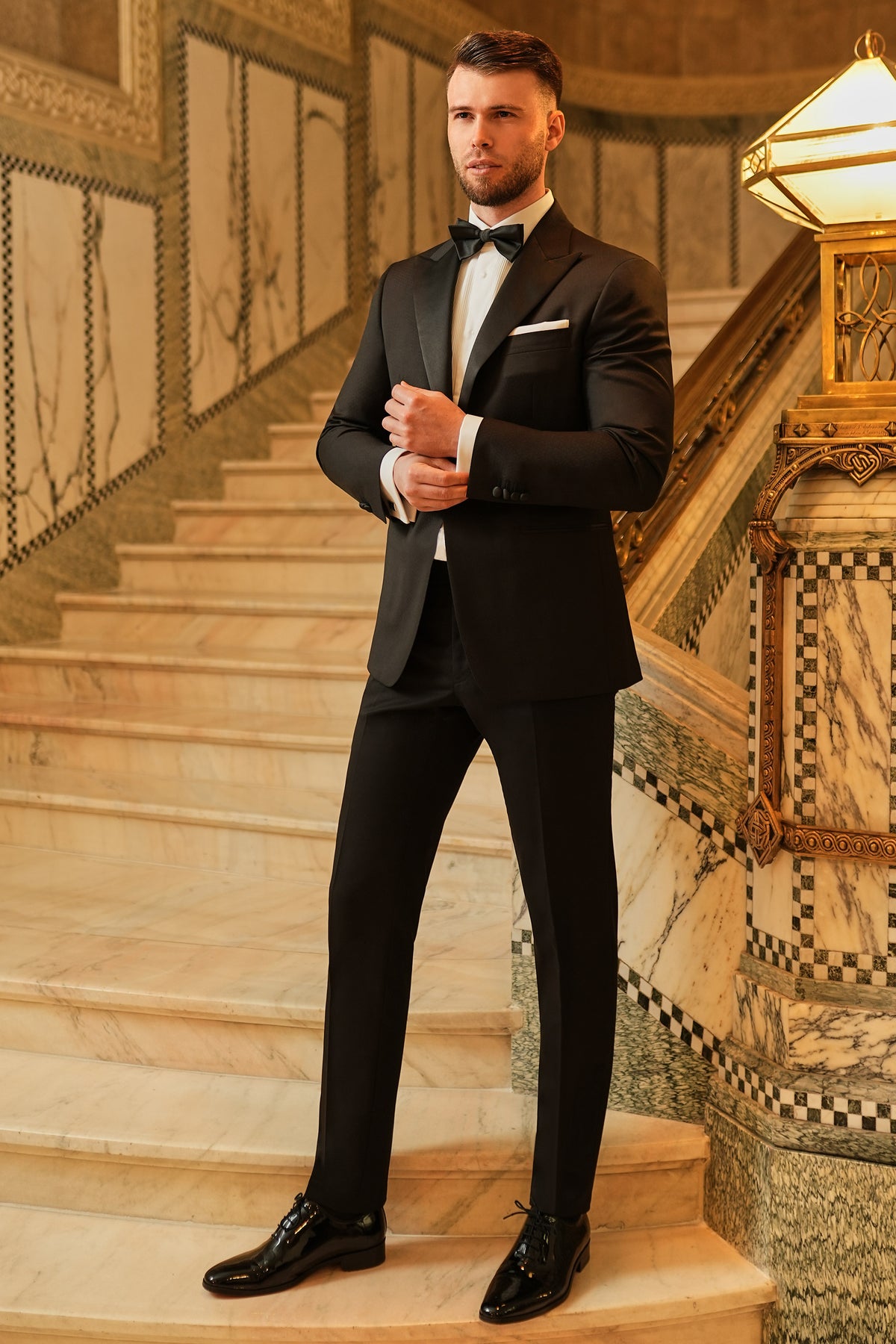 Consiglieri: black tuxedo with lustrous lapels, a white shirt and black bow tie