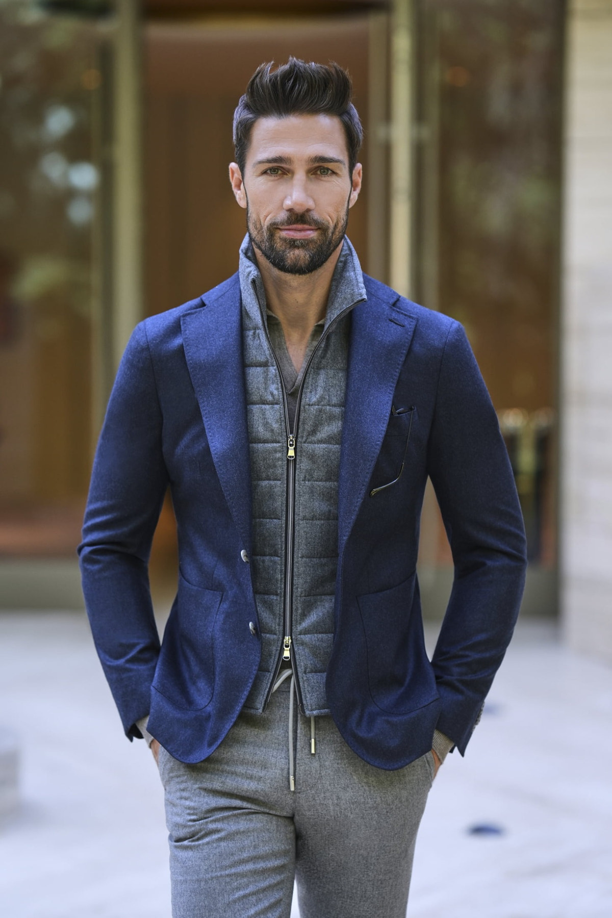 Consiglieri: grey zip-front gilet beneath a blue jacket