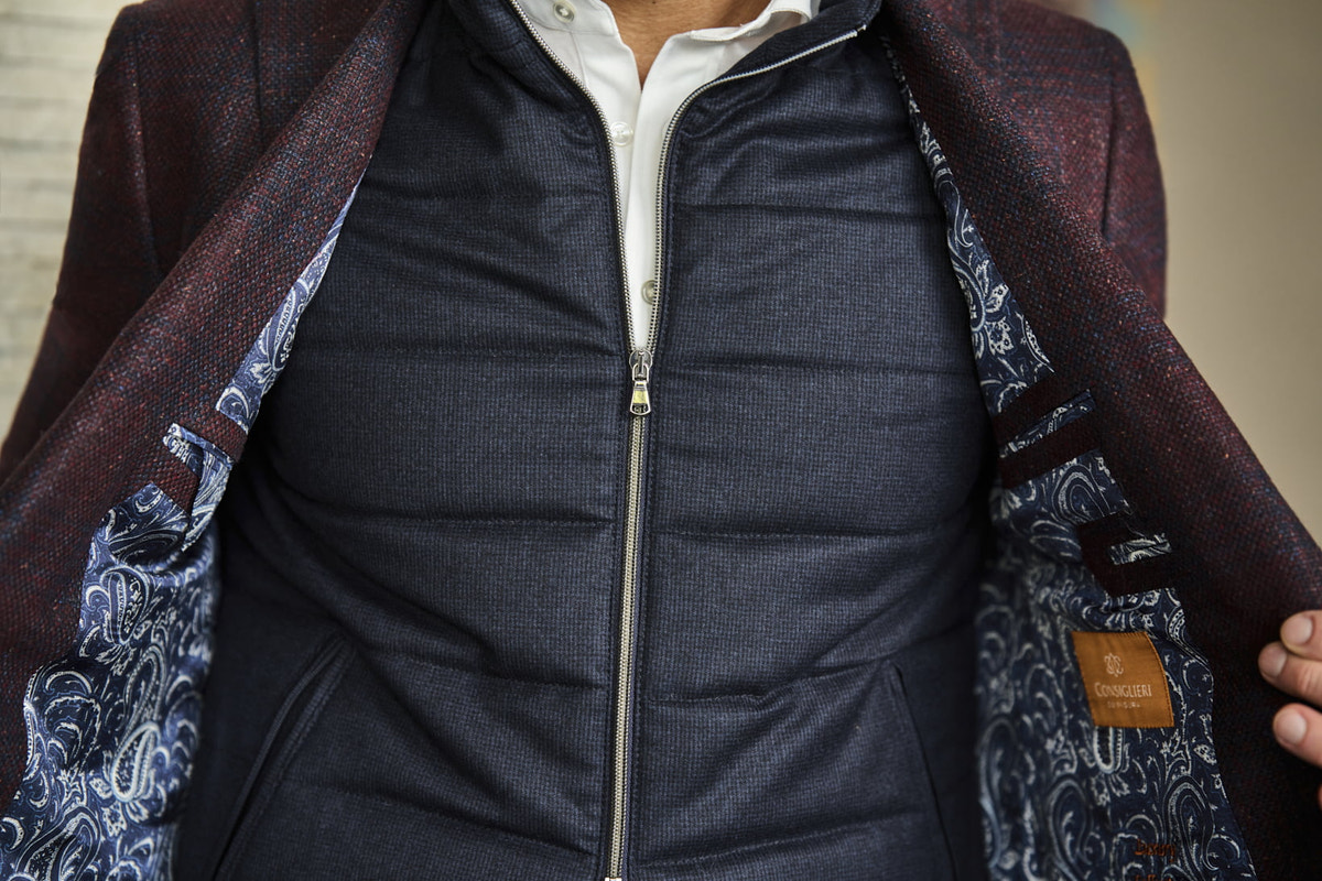 Consiglieri: navy quilted gilet and the jacket's patterned lining