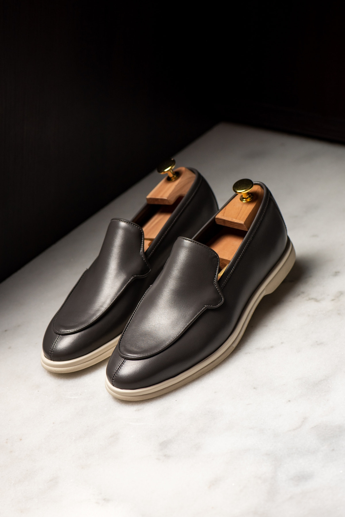 Consiglieri: dark grey loafers with a smooth finish and pale soles