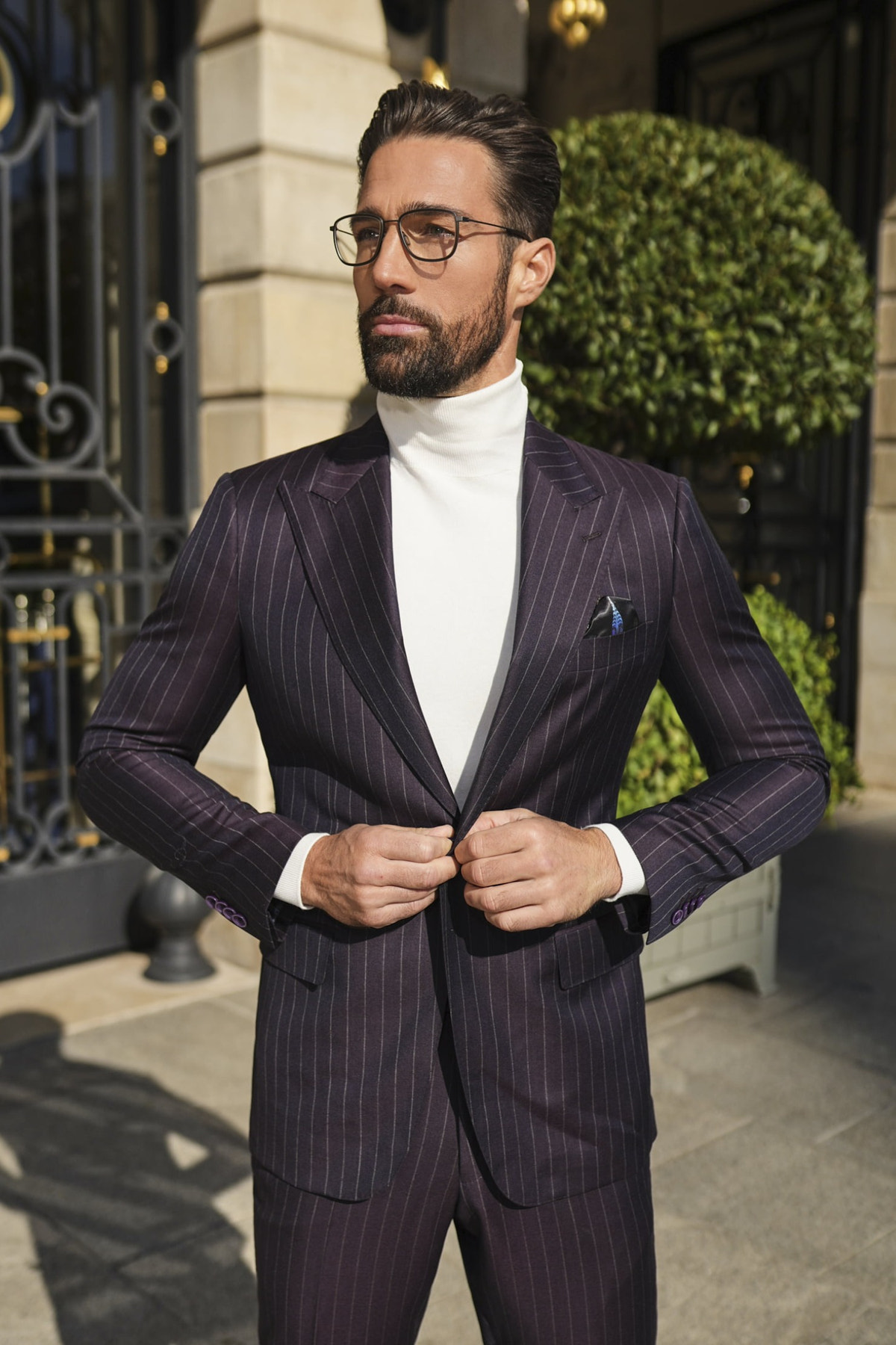 Consiglieri Monte Carlo: plum pinstripe suit styled with an ivory roll-neck