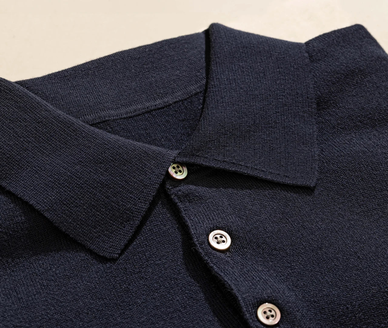 Navy polo collar and understated button details