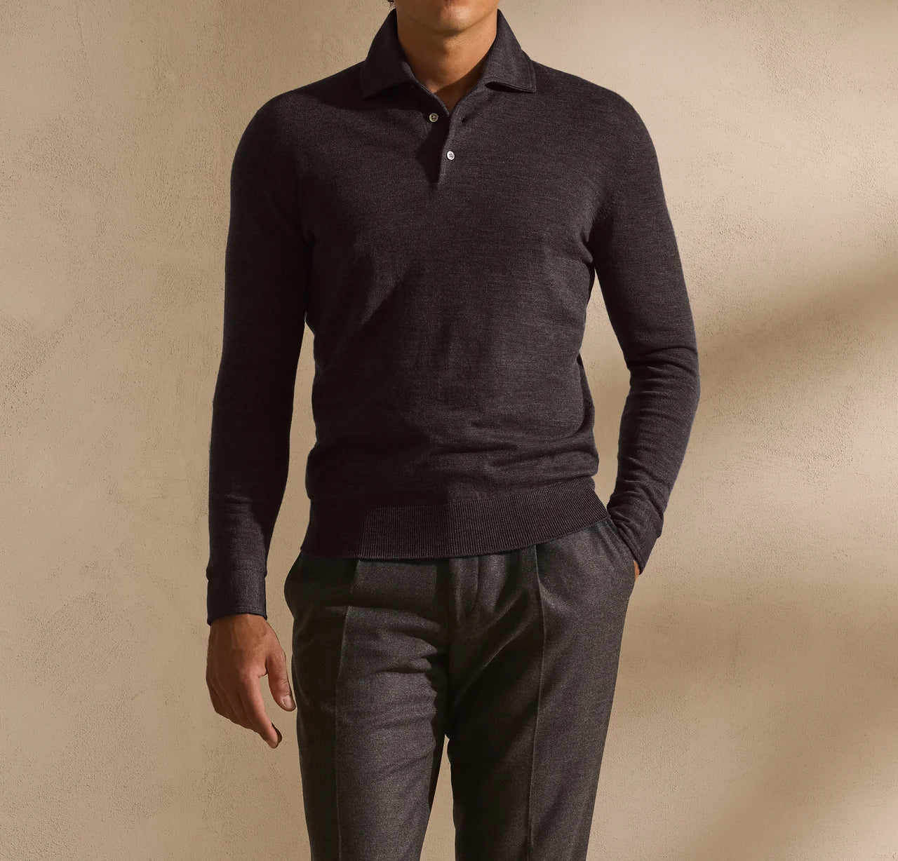 Dark long-sleeve polo with tailored trousers