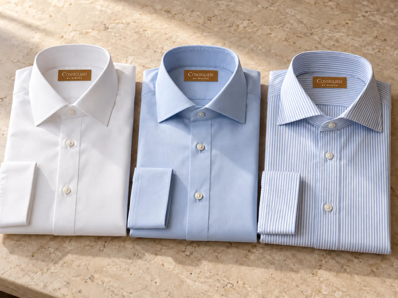 White and pale blue shirt collars with classic shapes and different spreads
